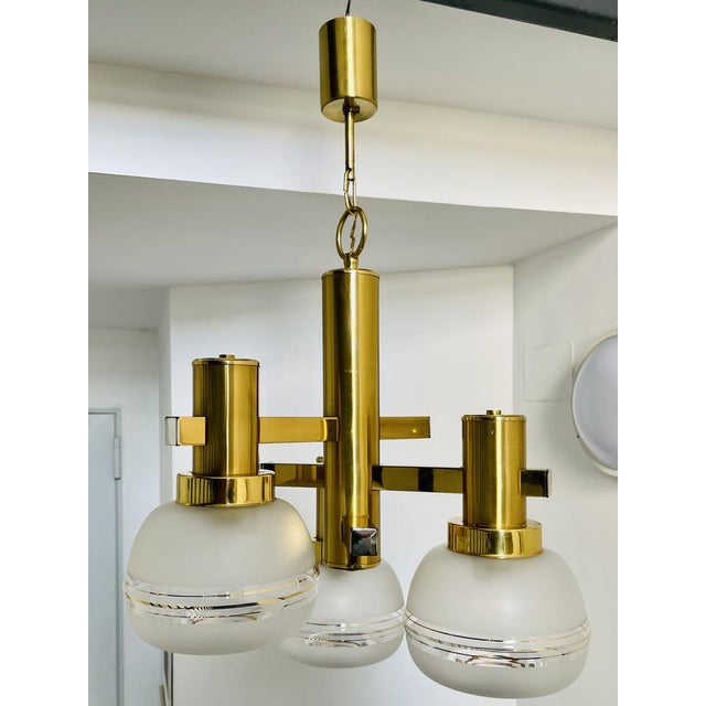 This lamp contains three tulips, it supports led bulbs. This piece is attributed to the mentioned designer/maker. It has...