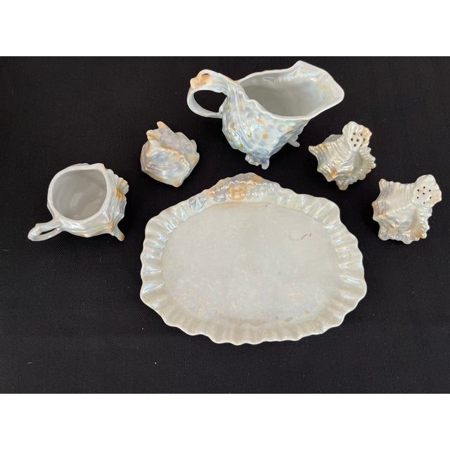 This is a serving set of Royal Bayreuth Porcelain. It is a Conch Shell pattern with an iridescent finish. The set consists...