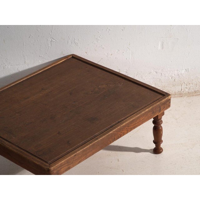 This antique japanese folding low table is a floor table in wood with folding turned legs. It originates from japan, from...