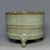 A stately Chinese celadon tripod vessel, showcasing restrained oriental beauty. The cylindrical body is adorned with...