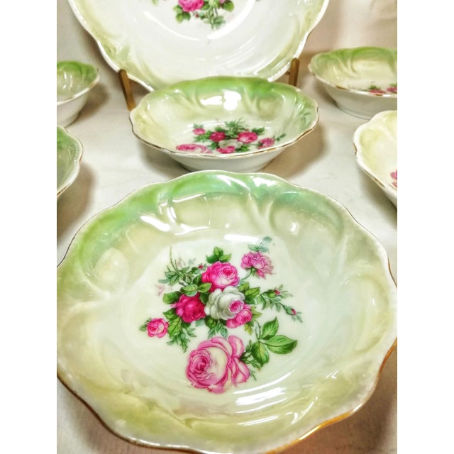 Dessert dishes from the 1930s made of porcelain. Glossy iridescent finish with fine floral decoration in the centre of...
