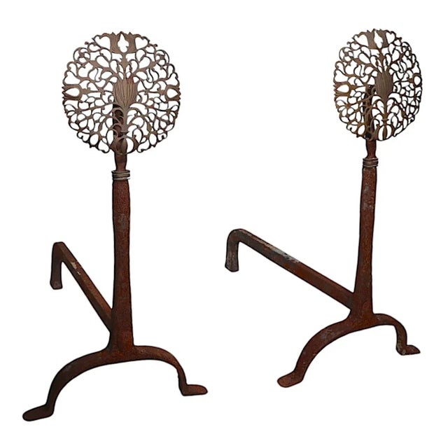 Classic pair of 19th C. style brass and wrought iron andirons, having ornate brass foliate medallion tops, executed in the...