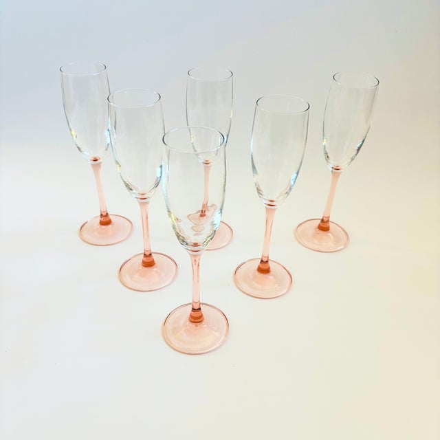 A lovely set of 6 vintage pale pink stemmed champagne flutes. Made in France, marked on the base.