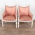 Pair of 20th century Swedish Gustavian-style armchairs with carved wood frames and older salmon/pink patterned upholstery....