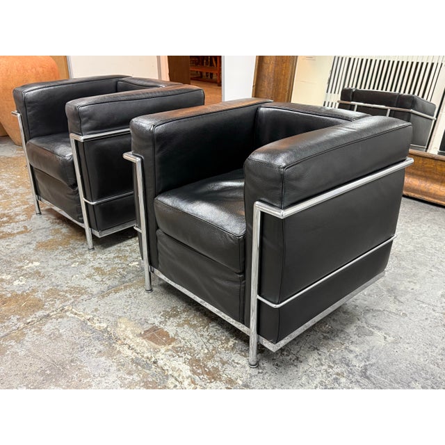 Design Plus Gallery presents a Pair of Le Corbusier Style Cube Lounge Chairs. Executed in the International Style, these...