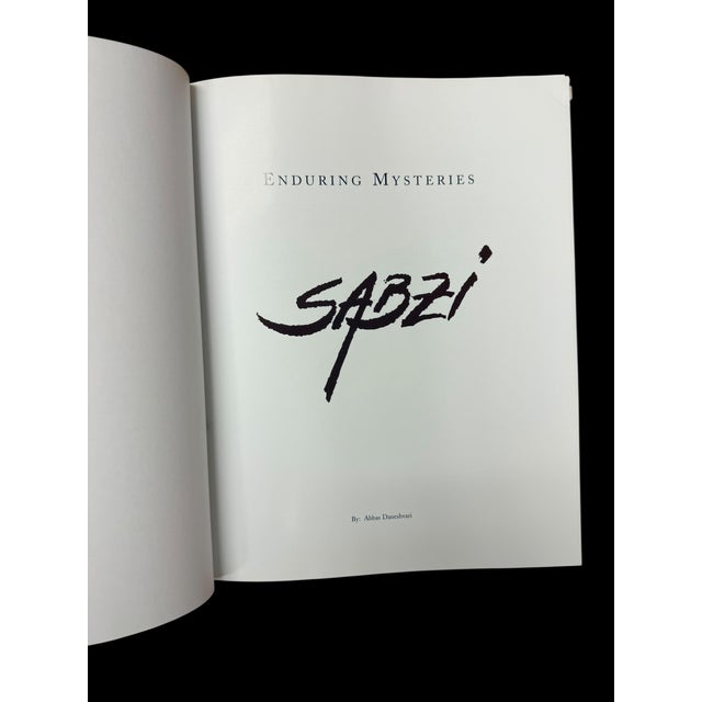 This signed by the artist hardcover coffee table book is filled with extraordinary images of Sabzi's works. "Enduring...