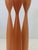 striking set of three Danish Modern spindle candlesticks, crafted from turned solid wood and finished in a matte...