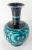 We are selling this beautiful Japanese cloisonne enamel vase. This black ground vase has teal floral decoration with...