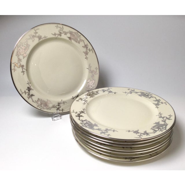 Elegant set off eight Bavarian chinoiserie silver overlay service dinner plates. Each with a chinoiserie sterling overlay...