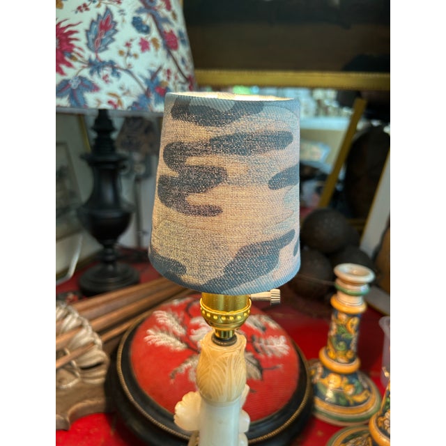 A clip top chandelier shade handmade with Fortuny’s iconic printed fabric. Measurements: top 3” bottom 4” side 4”