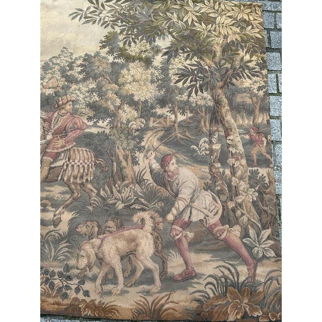 Discover the elegance of this exquisite French tapestry featuring a charming scene of a princely hunt. This tapestry...