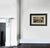Handsome black and white watercolor and ink painting in a new black wood frame with a linen matte. This painting is dated...