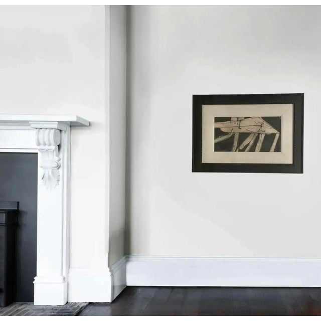 Handsome black and white watercolor and ink painting in a new black wood frame with a linen matte. This painting is dated...