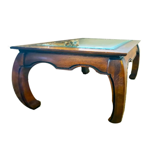 A rectangular wood Ming style side table with Chow legs features a beveled glass inlay center. The table is handsomely...