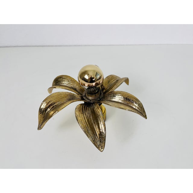 A set of brass flushmounts by Willy Daro for Massive made in Belgium in the 1960s. The lamp has a beautiful wheat sheaf...