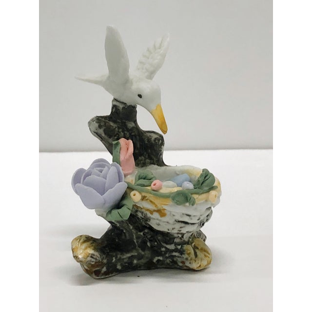 This Rare Vintage 1970s Hummingbird with Eggs Nest Porcelain Figurine is a delightful decoration for any room of your...