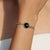 A refined sterling silver piece featuring a captivating Black Star gemstone, thoughtfully designed for understated...