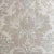 Soft neutral tones in an abstract floral are hand screened on a natural linen by a local artist. A matching petite rope in...