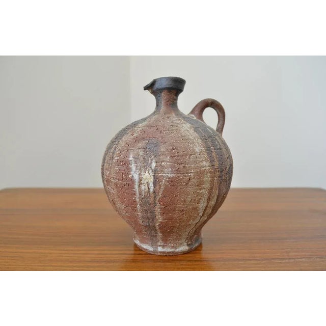 Studio ceramics by Gerhard Liebenthron The vase is made of a red brown ceramic - the vase in the ground is met with the...