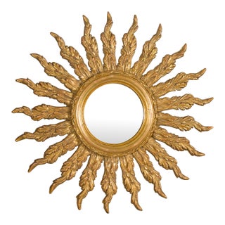 French Giltwood Sunburst Mirror with Wavy Sunrays from the Mid-20th Century For Sale
