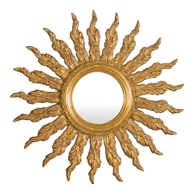 French Giltwood Sunburst Mirror with Wavy Sunrays from the Mid-20th Century For Sale