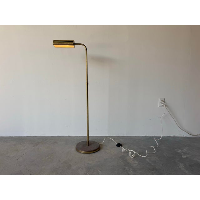 Elegant 1970s Mid-Century Modern adjustable brass floor lamp in the style of Koch & Lowy. This classic design features a...