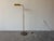 Elegant 1970s Mid-Century Modern adjustable brass floor lamp in the style of Koch & Lowy. This classic design features a...