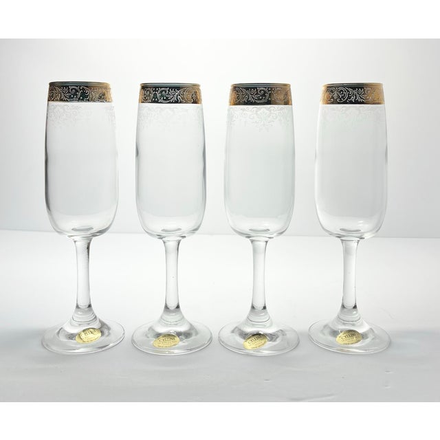Cellini Gold Crystal Set of 4 Fluted Champagne Glasses 7 3/4” 6oz w/Box, Italy Excellent condition. No chips, cracks, or...