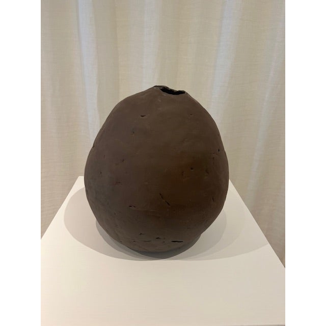 Dimensions: 9.5” diameter x 10.5” h Material: stoneware Finishing: unglazed Color: mushroom Edition: one-ok-a-kind