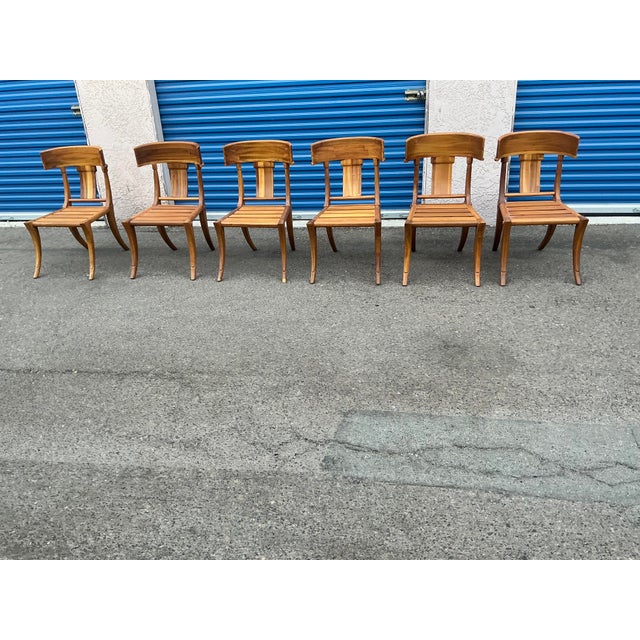 Set of 6 teak Klismos patio chairs. The chairs are made of solid Peruvian Teak. Finished and ready to enjoy. Set is well...