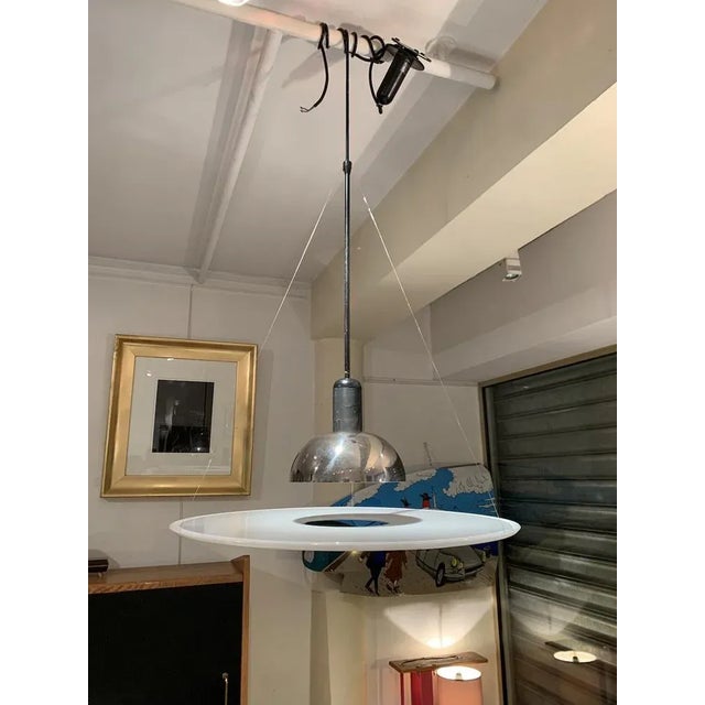 Castiglioni " Frisbi " suspension lamps Flos Edition Circa 1978 PPMA / steel / metal Dimensions : 60,5 x 73 This piece is...