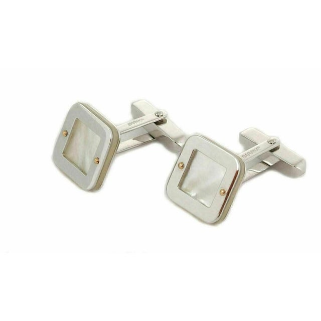 The Baraka Mother of Pearl 18k Two Tone Gold Square Top Stud Cufflinks are a luxurious and stylish accessory for men....