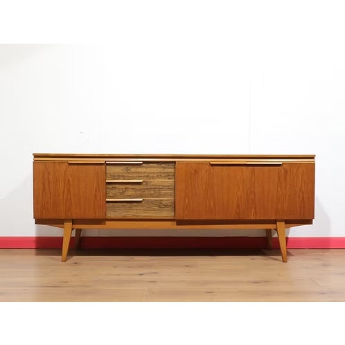 Discover a gorgeous mid century credenza that perfectly embodies Mid Century Traders' dedication to authentic vintage...