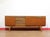 Discover a gorgeous mid century credenza that perfectly embodies Mid Century Traders' dedication to authentic vintage...