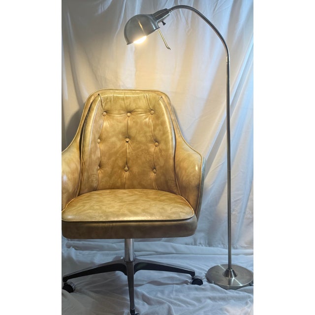 A vintage Stoneville Furniture Co. swivel executive chair in warm camel-toned upholstery. This sculptural desk chair...