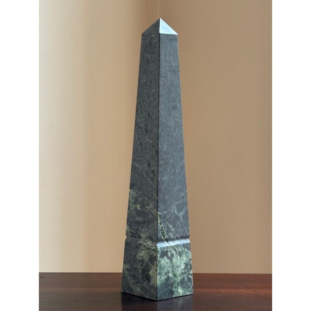 Offering a beautiful 16" Neoclassical-style dark green marble obelisk from the mid- to late-20th century. Love the natural...