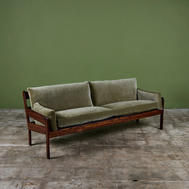 Brazilian rosewood sofa with a sleek, open-slat frame that maintains an airy visual footprint despite its spacious seating...