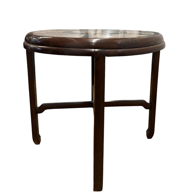 This elegant round table is a classic example of the Old Shanghai style from the early 20th century. It is masterfully...