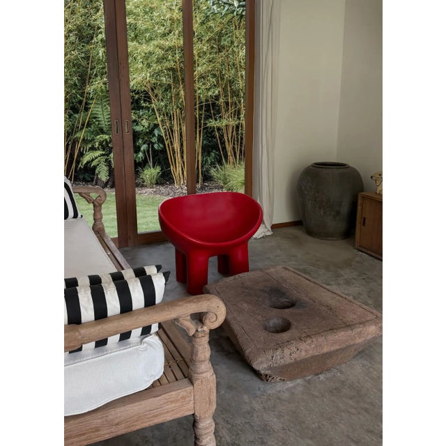 This striking piece is an antique rice mortar from Java, meticulously hand-carved from a single block of hardwood. Dating...