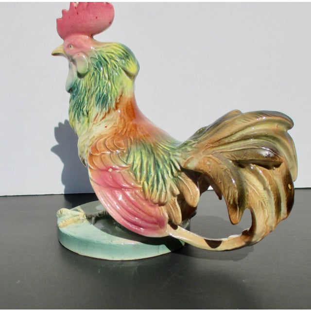 Fighting Cock. Lovely shaded rose and green glazes over a beautifully poised rooster image. Finely carved and balanced in...