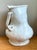 This striking monumental white ceramic vase captures the essence of artisanal craftsmanship with its impressive scale and...
