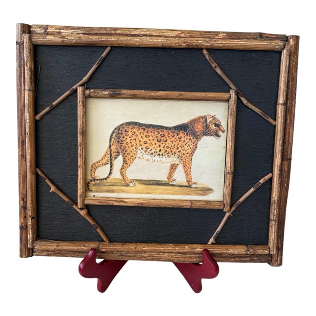 A coordinating pair of decorative animal prints depicting an elephant and a leopard in warm, natural-history-style...
