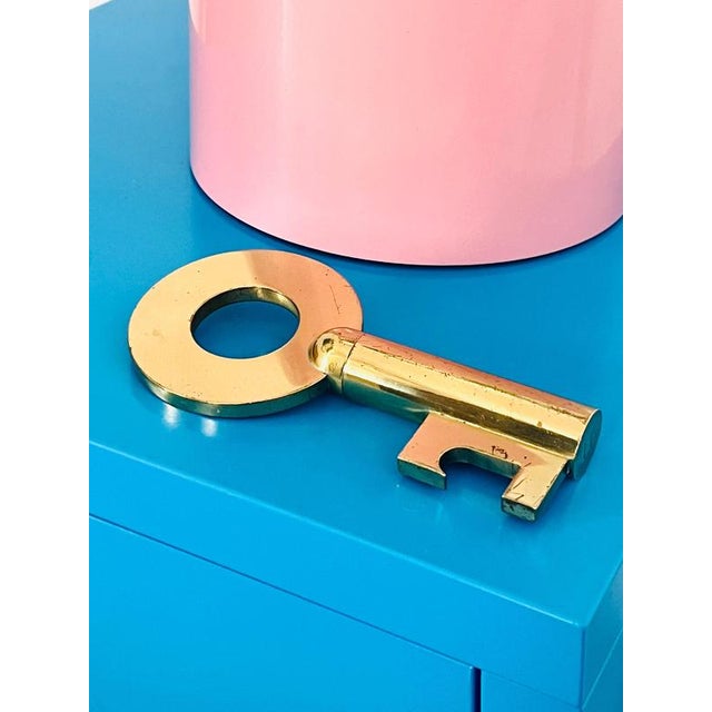 This beautiful and oversized, vintage Mid-Century brass key combines a corkscrew for opening wine bottles and a bottle...