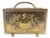 This midcentury French brass magazine rack features a striking family coat of arms pressed into the brass, along with...
