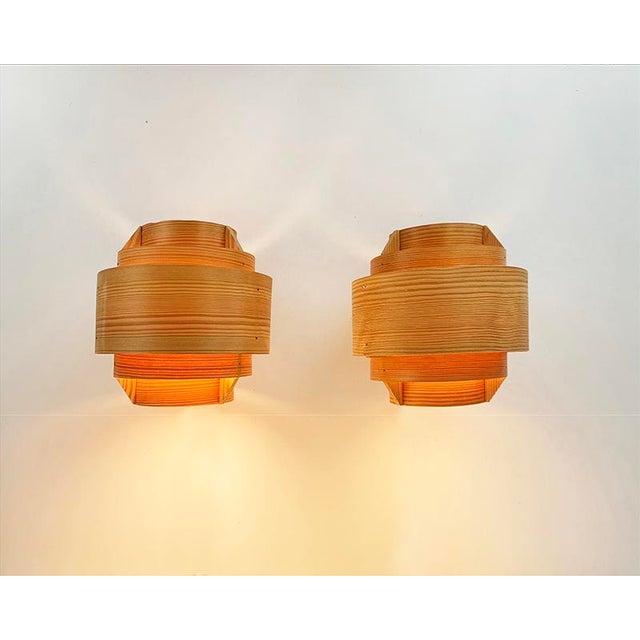 Pine veneer Wall lamps model V327 by Hans-Agne Jakobsson. Manufactured by AB Ellysett in Sweden. The sconces are composed...