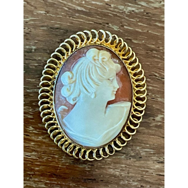 This vintage Victorian 12k hand-carved cameo pendant is a fine example of nineteenth-century-inspired jewelry...