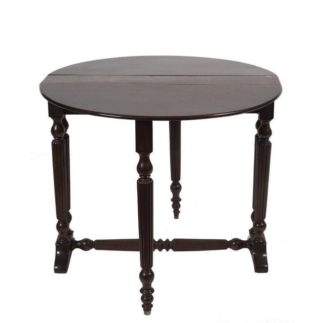 This mahogany side table is a beautiful design furniture piece realized in Italy by Anonymous artist in the late 19th...