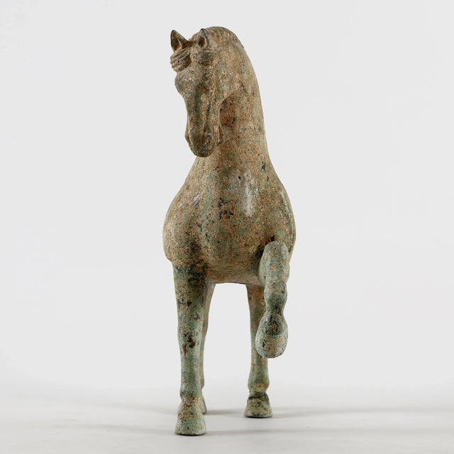 Discover the captivating allure of Contemporary Distressed Green Bronze Horse Statue Hoof Up! Crafted in China, this...