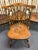 A handsome set of four Ethan Allen Windsor-style dining chairs, consisting of two armchairs and two side chairs. Crafted...