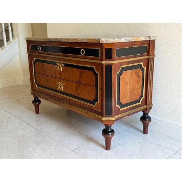 A finely constructed French Louis XVI-style flat-front commode with 3 drawers, produced in Paris during the Belle Epoque...